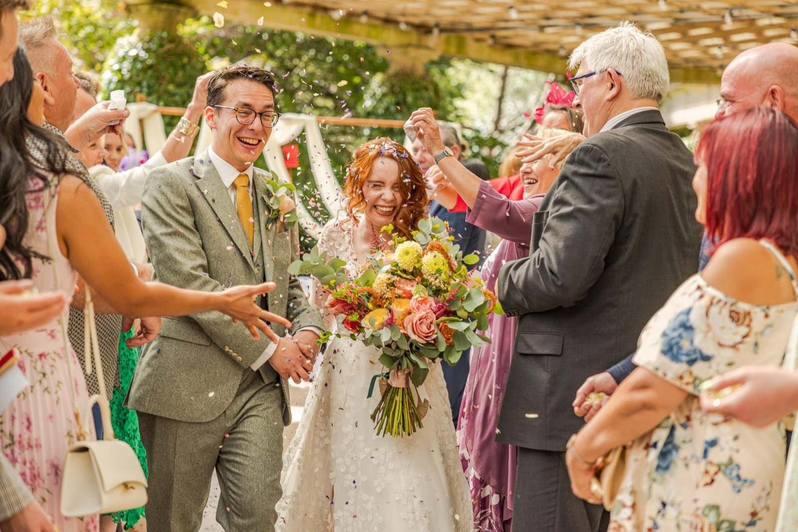 Ceremony backdrop of wild seasonal flowers and foliage