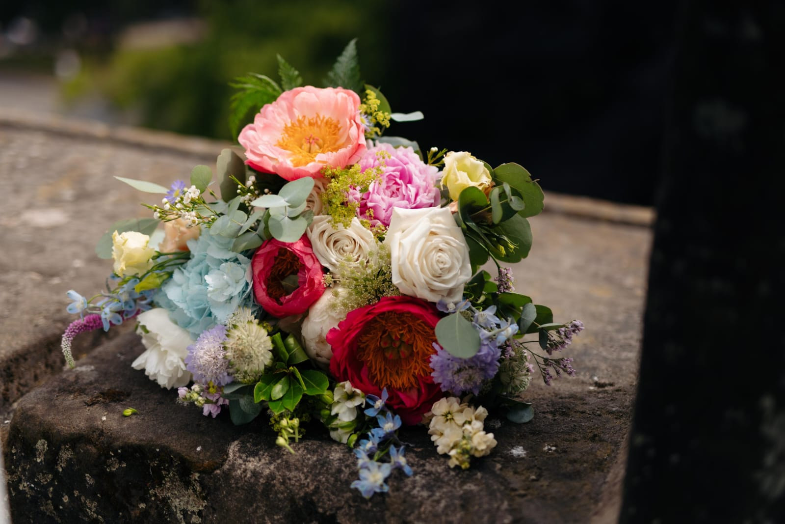 Table centrepiece of garden roses and soft foliage
