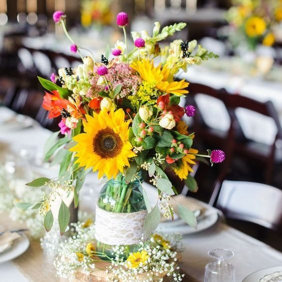 Detail of seasonal flowers and wild foliage arranged by hand