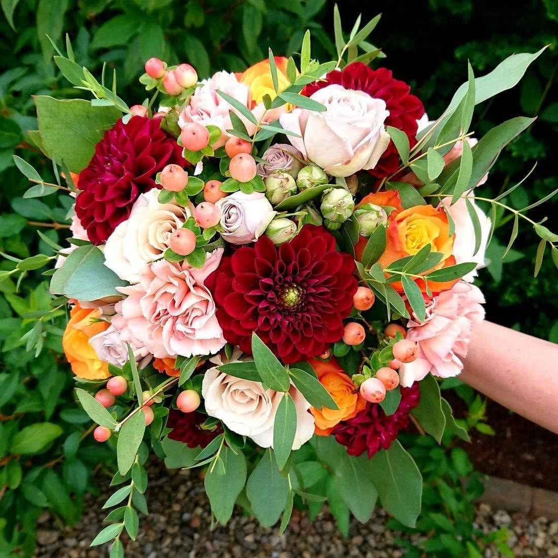 Wedding breakfast table styled with a meadow-style floral runner
