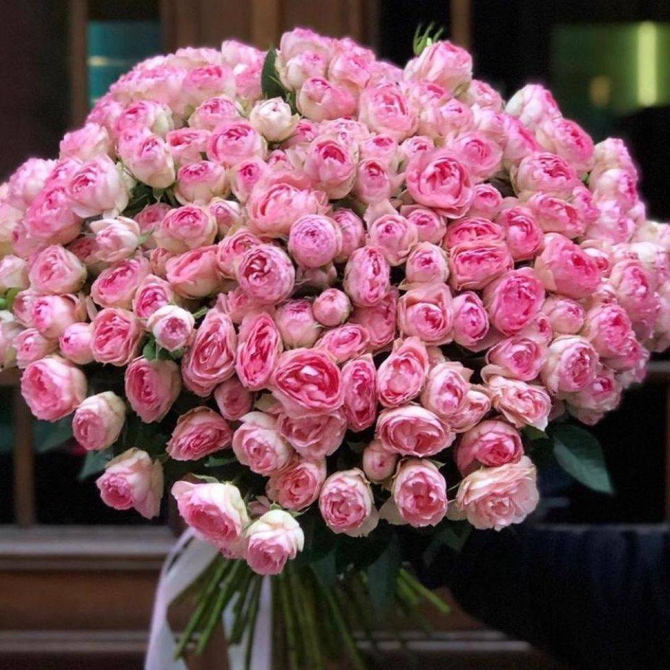 Detail of a hand-tied bouquet showing layered petals and foliage